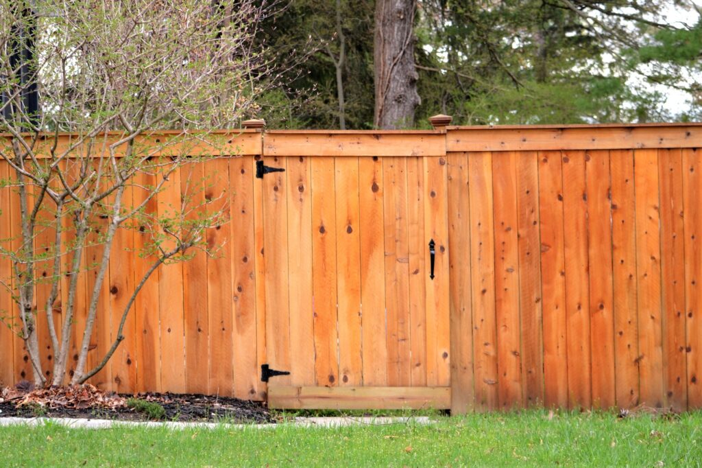 Wooden stained fence made out of lumber